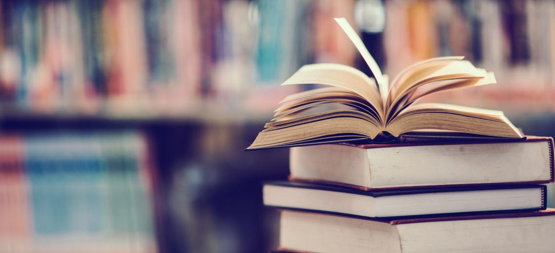 Book in library with open textbook,education learning concept © SANGMANEE